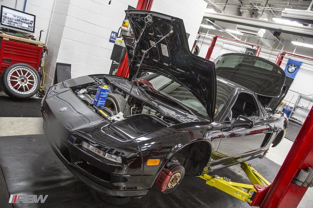 An Acura NSX with the engine cover open in the service bay at RSW in Kinnelon, NJ