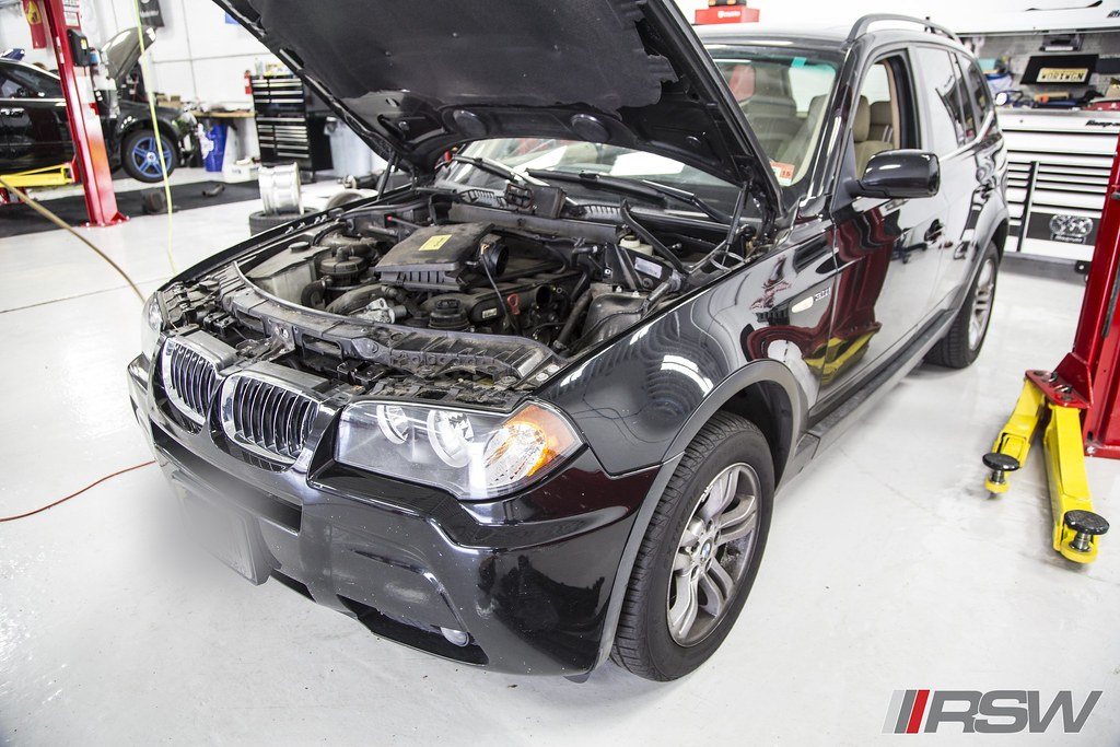 A BMW X3 with the hood open for an oil service at RSW Auto Repair in Kinnelon, NJ