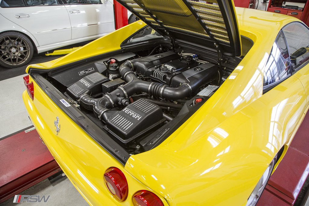 The engine bay of a Ferrari F355 open for service at RSW in Kinnelon, NJ