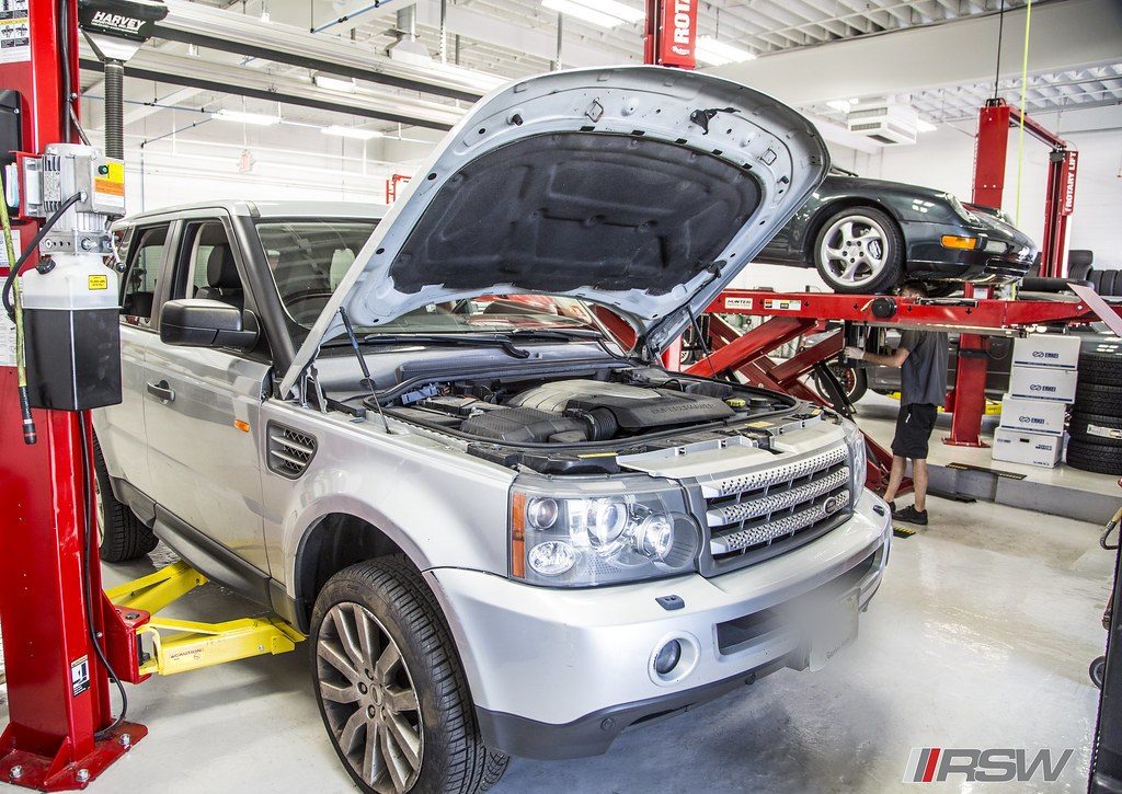 Range Rover Sport with the hood open in the service bay at RSW in Kinnelon, NJ