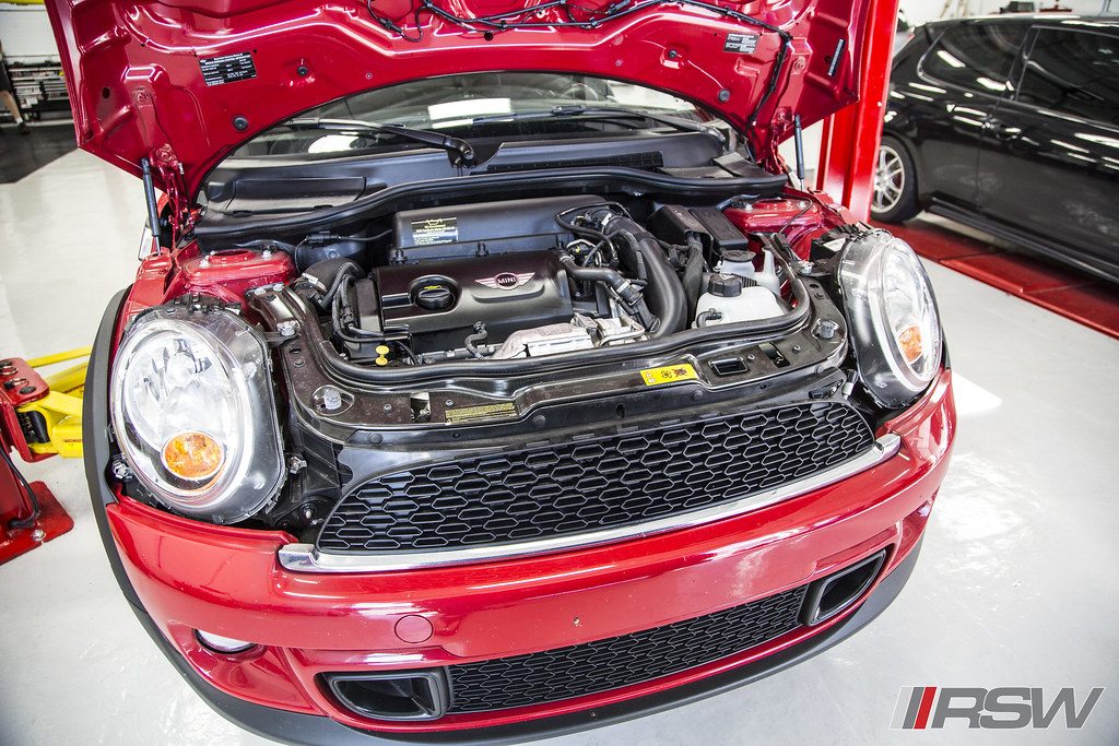 A MINI Cooper with the hood open in the service bay at RSW in Kinnelon, NJ
