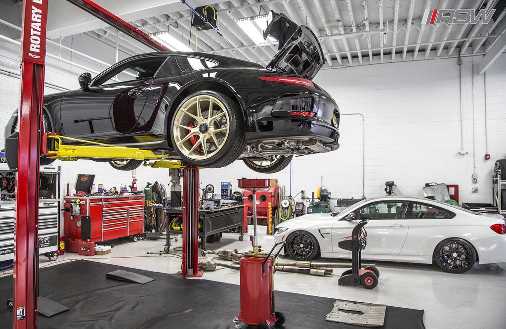 A car raised on the lift in a service bay at RSW Auto Repair in Kinnelon, NJ