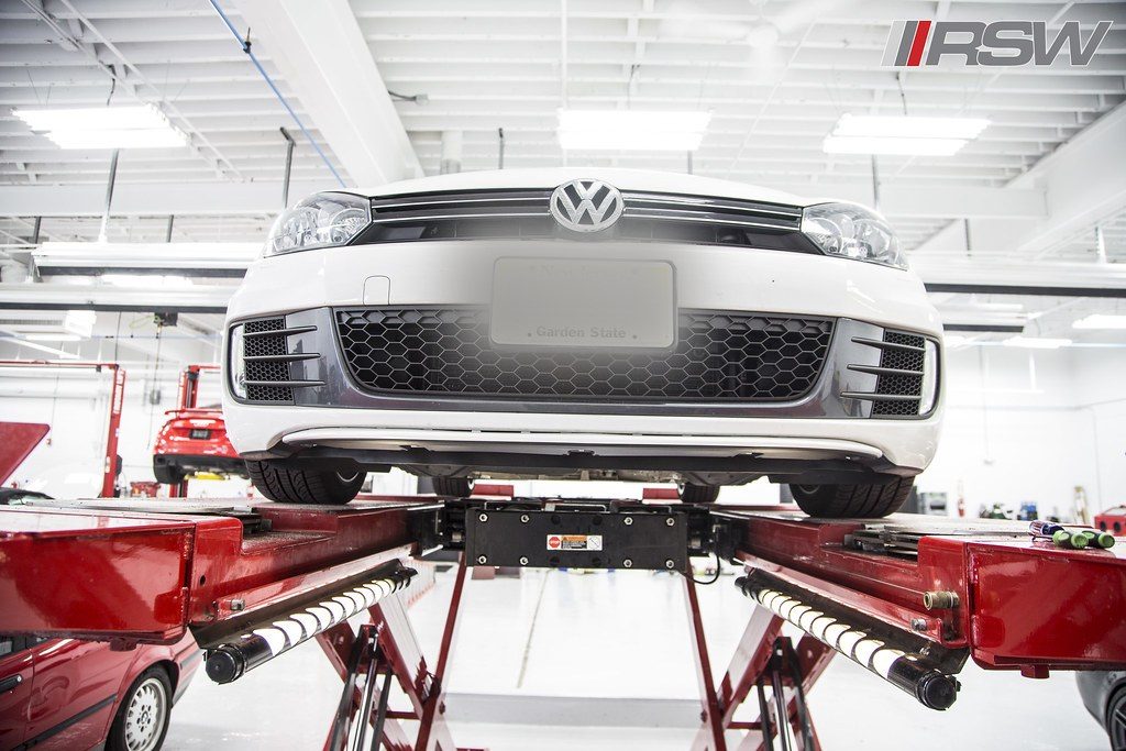 A vehicle on the four wheel alignment rack at RSW Auto Repair in Kinnelon, NJ