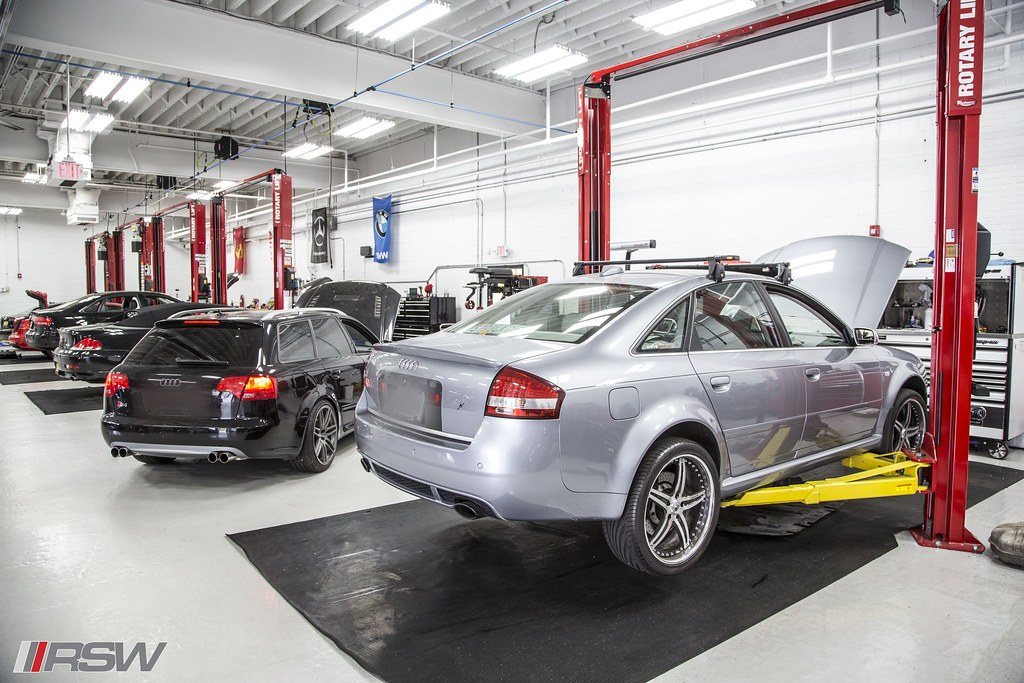 Cars raised on the lifts in the service bays at RSW Auto Repair in Kinnelon, NJ