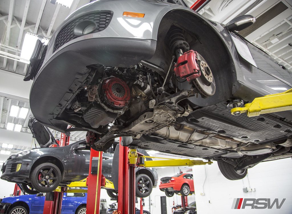 The underside of a car on the lift with the clutch and bell housing exposed at RSW Auto Repair in Kinnelon, NJ
